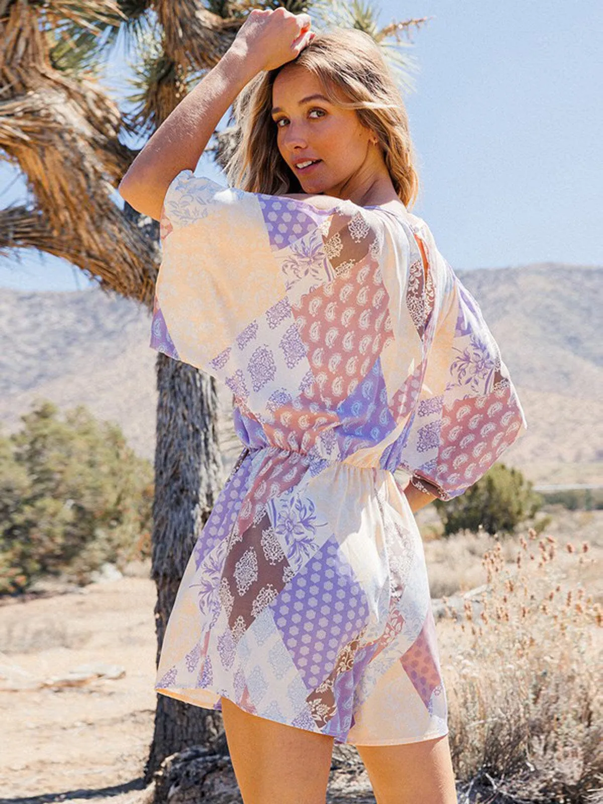 WOMEN'S SHORT SLEEVE SURPLICE MULTI PRINT ROMPER